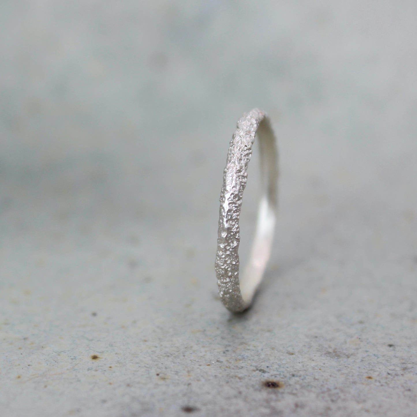 Tiny Mbégté ring | sand texture