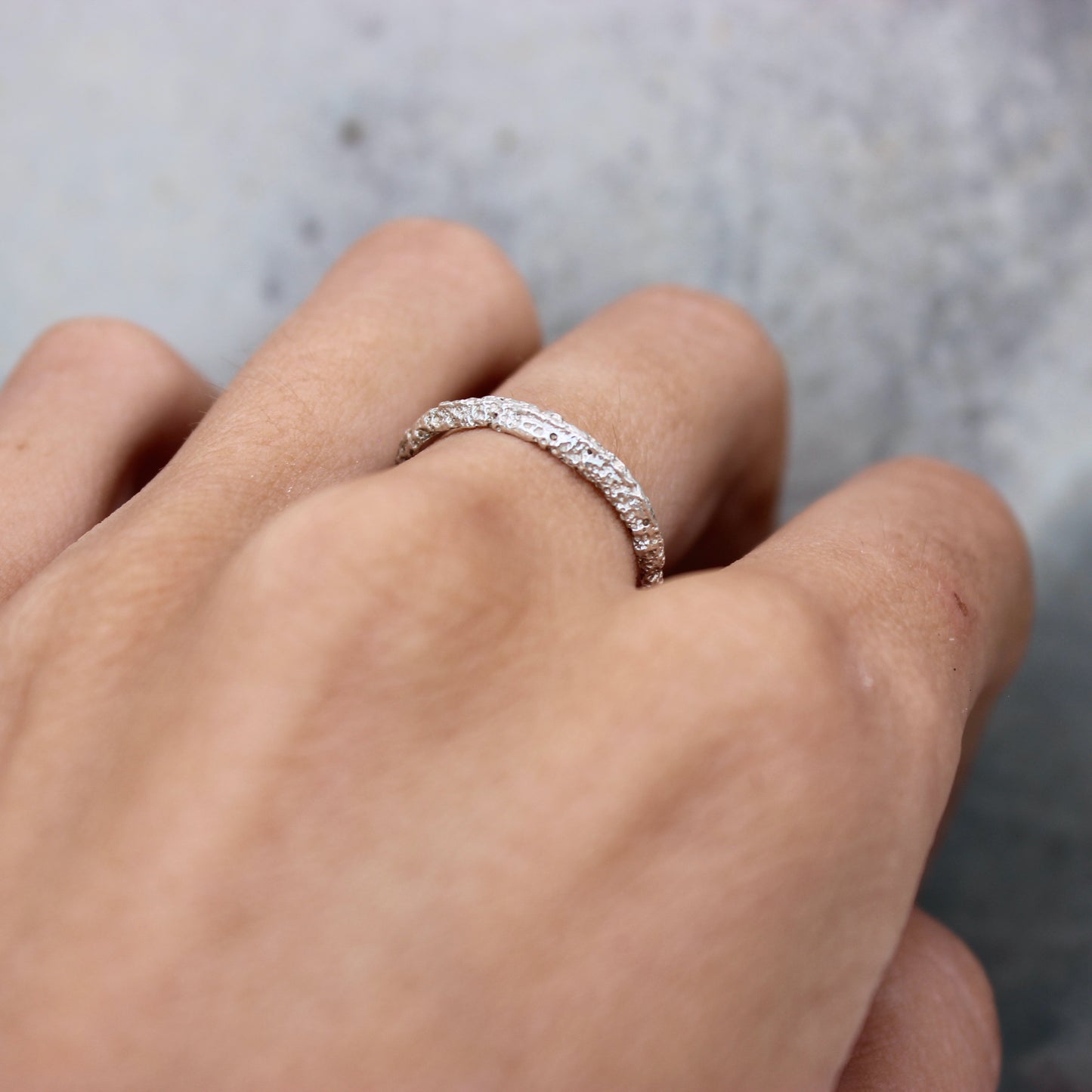 Tiny Mbégté ring | sand texture